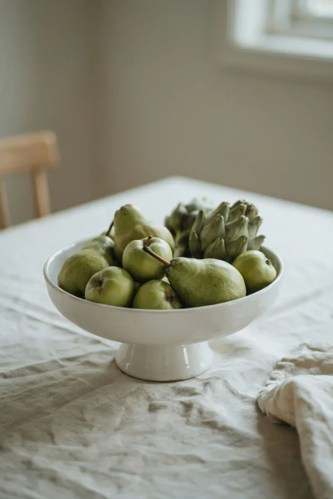 Neutral-Toned Fruit Arranged in a Pedestal Bowl