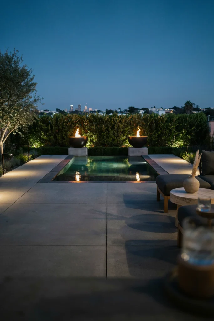 Concrete Patio with a Reflecting Pool and Fire Bowls