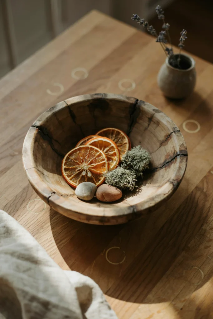 A Wooden Dough Bowl with Dried Fruit or Mos